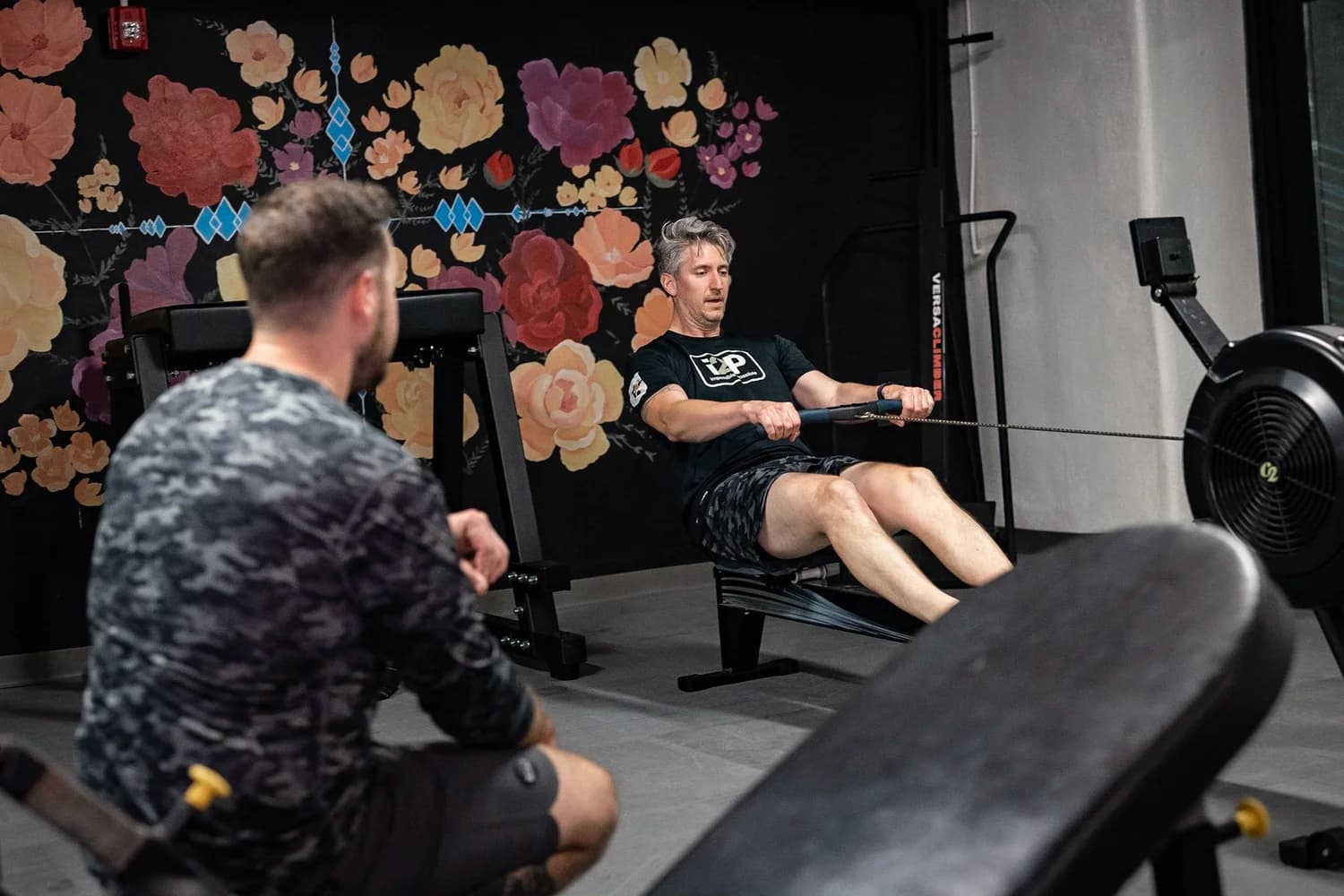 A Trainbetr coach training a client on the rower